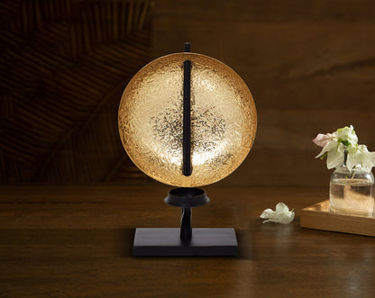 This retro-modern candle/pillar holder is crafted in antique brass with the candle holder in matt black adding a timeless mood to any space with table 
