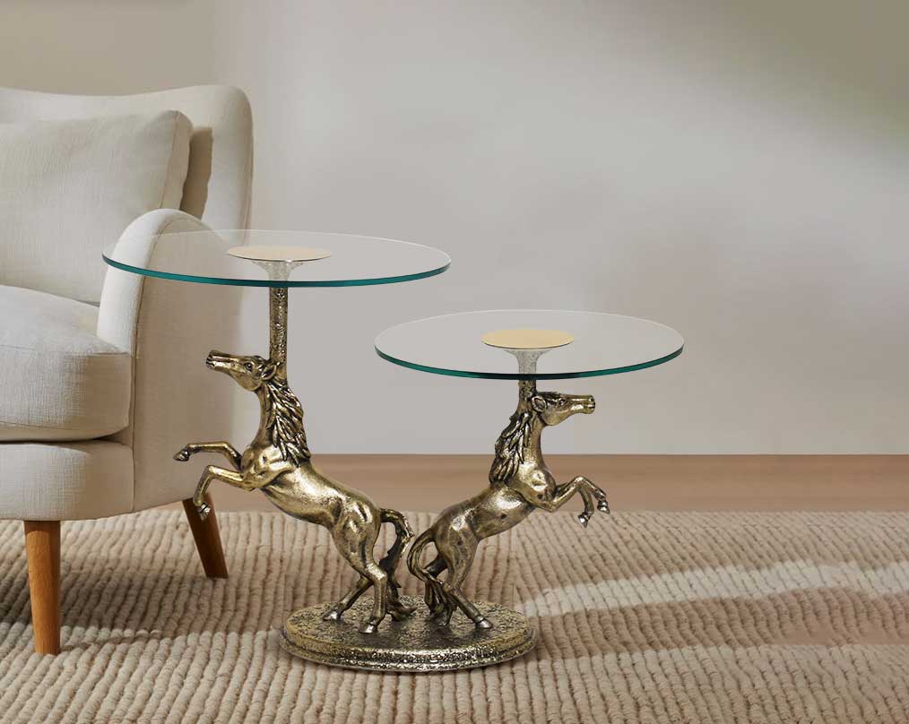 This vintage two-tier end table in antique gold finish Aluminium base with sofa