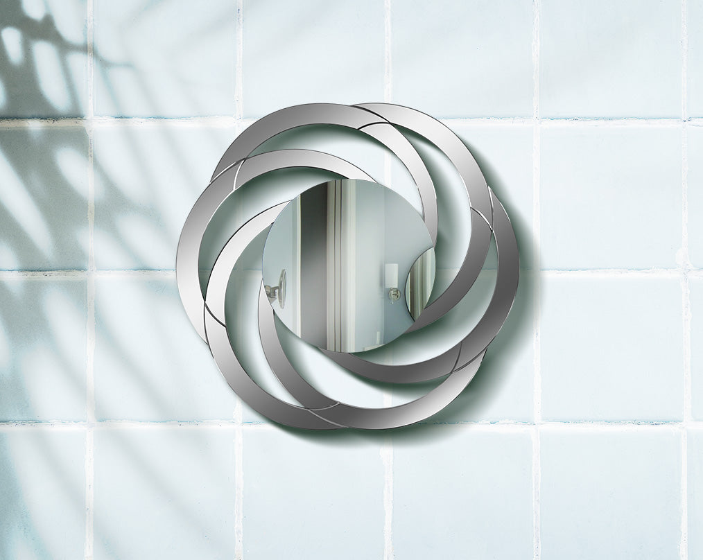 Gorgeous and glamorous, this versatile mirror  with wall features mirrored circles in an interweaving pattern.