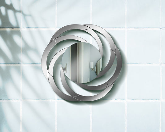 Gorgeous and glamorous, this versatile mirror  with wall features mirrored circles in an interweaving pattern.