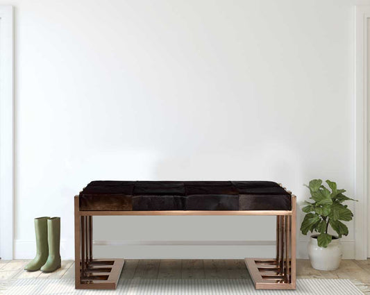 Double bench upholstered in dark brown leather hide seat and rose gold polished stainless steel legs in rich contemporary design with flower plant 
